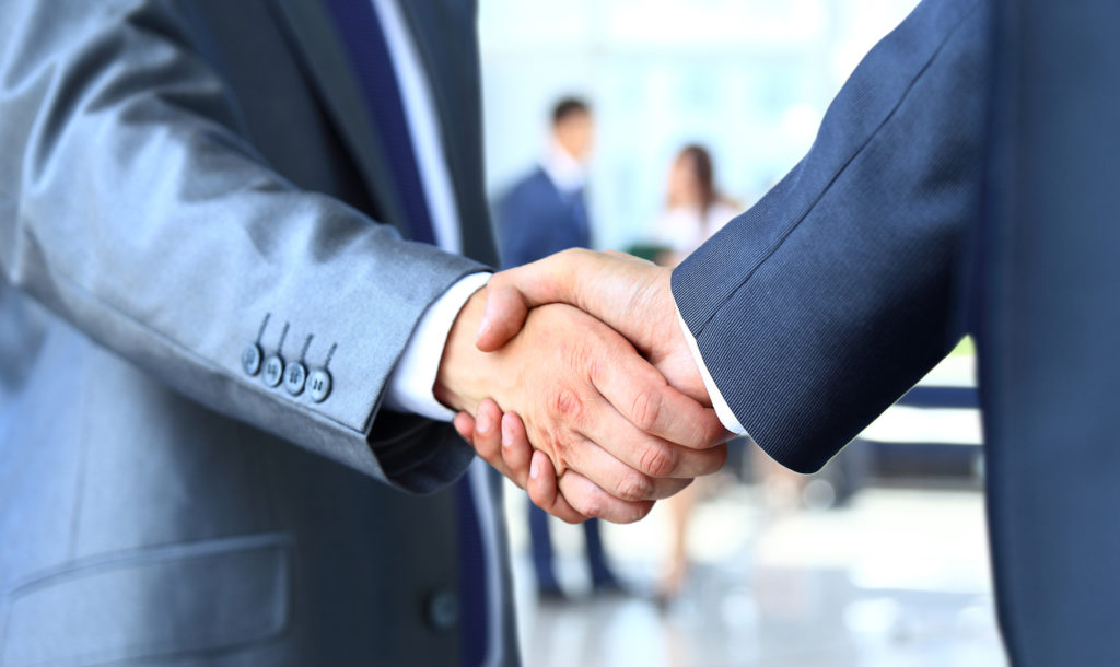 Two businessman shaking hands